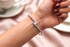 The Elara Emerald-Cut Halo Bangle
